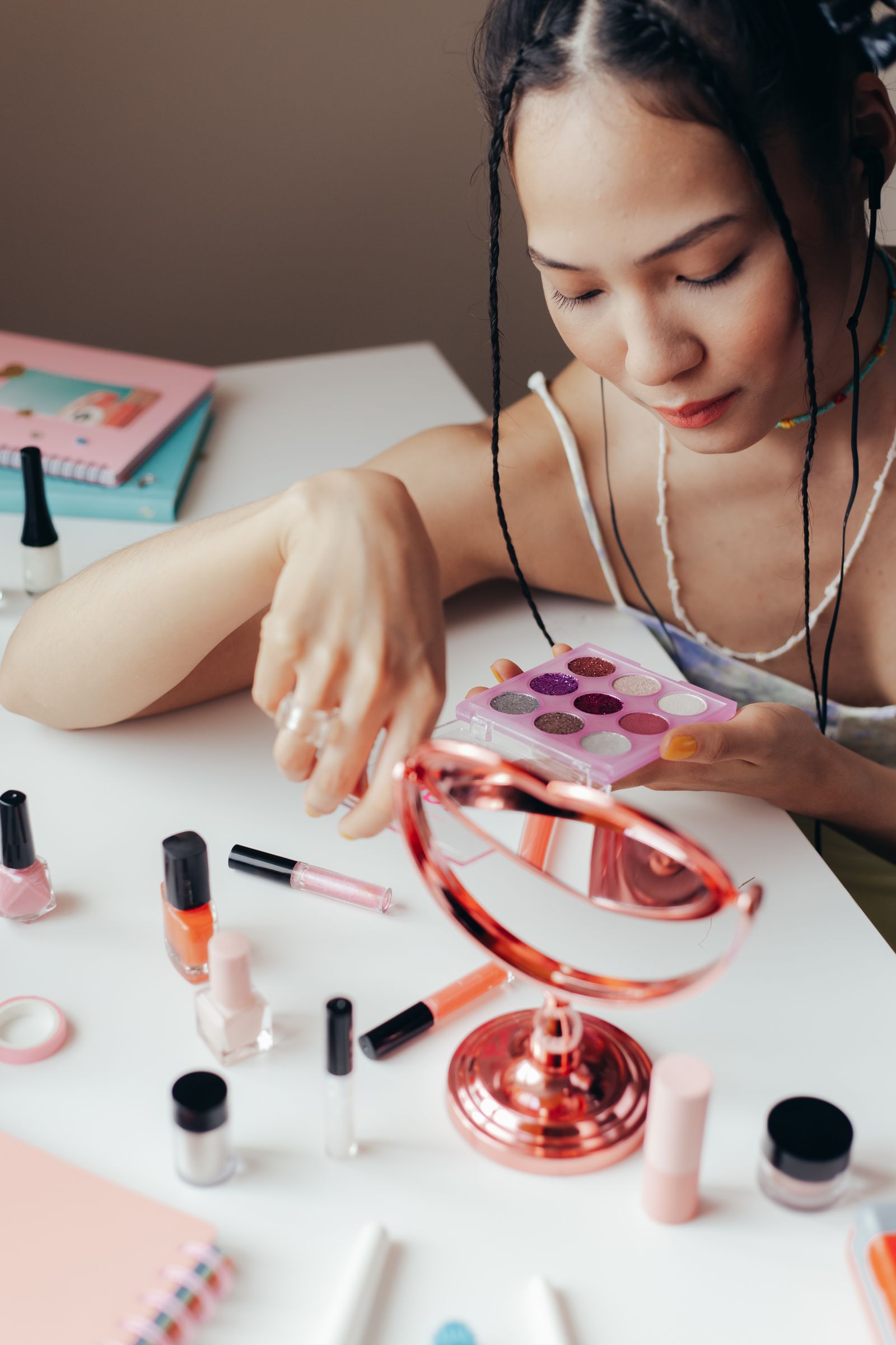 Cosmetic products and applicators arranged on a neutral background illustrating international beauty packaging route into china