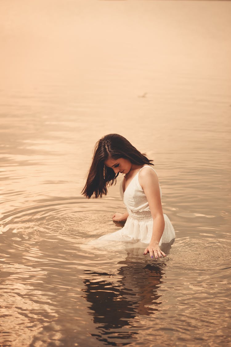 Woman In Dress In Water