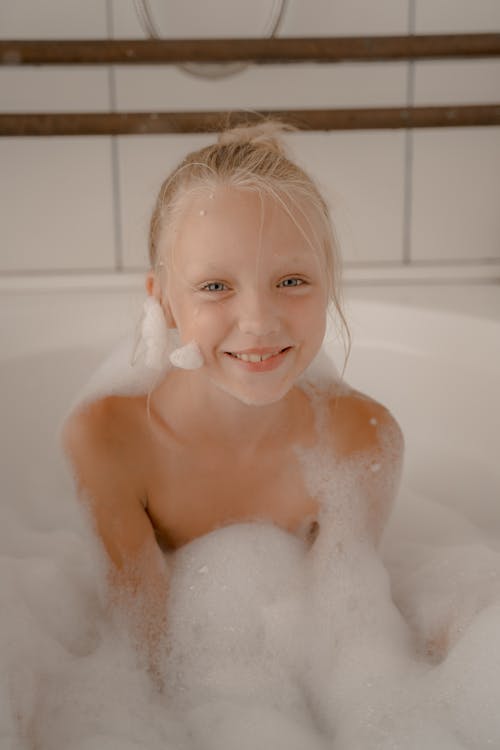 Free Smiling Child during Bubble Bath Stock Photo