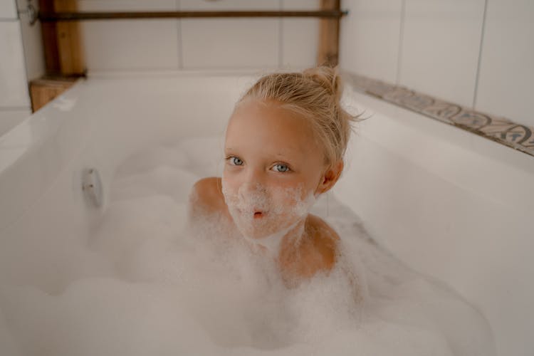 Child Having Fun In Bubble Bath