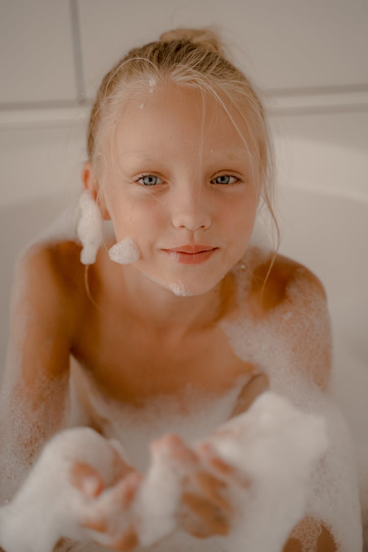 Child Playing With Foam During Bubble Bath