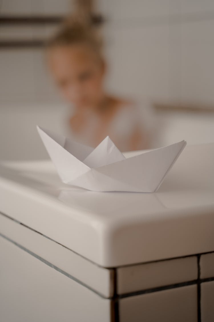 Paper Toy Boat On Bathtub