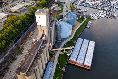 Free Aerial shot showcasing industrial facilities and a marina in Red Wing, MN during the day. Stock Photo