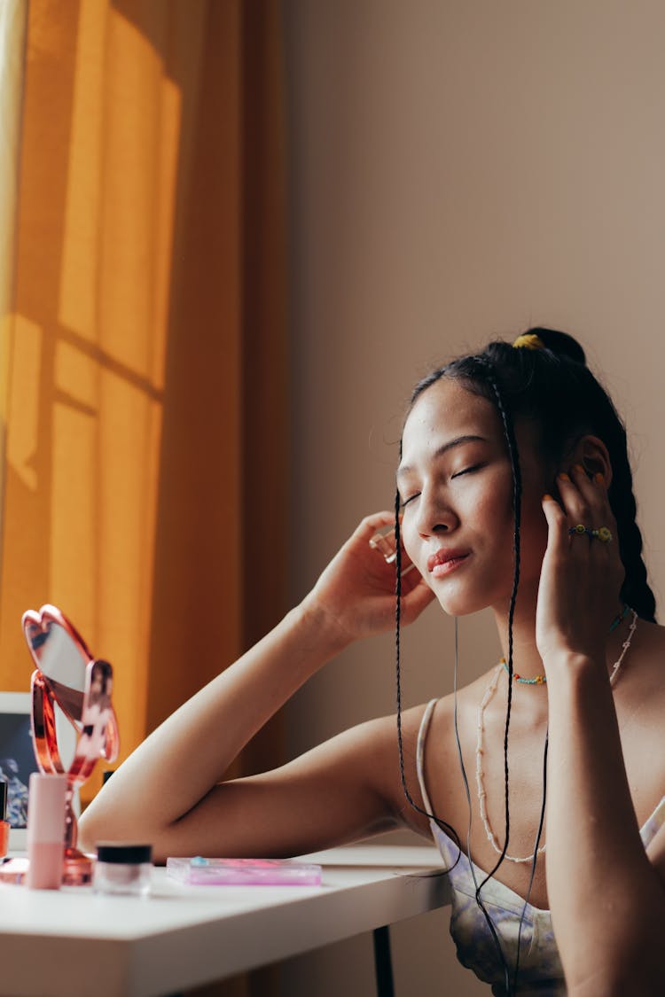 Girl Listening To Music On Earphones