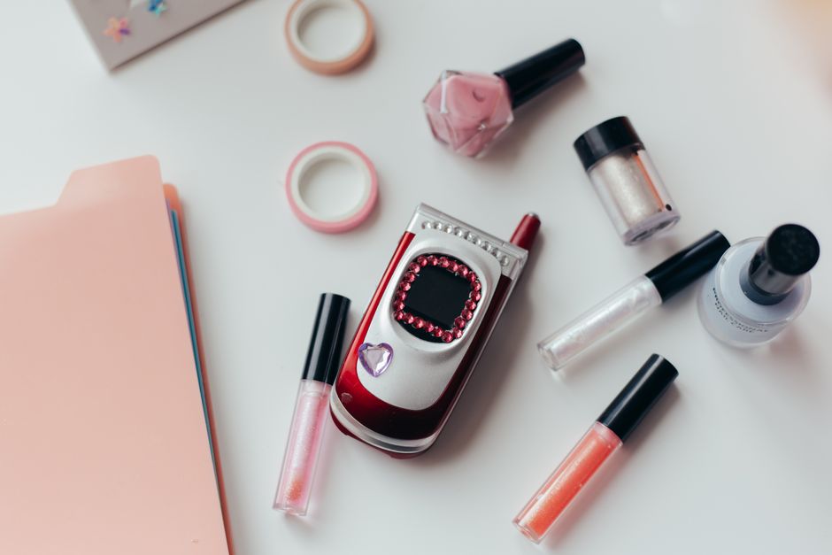 Side-by-side comparison of modern smartphone and retro flip phone