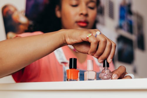 A Woman Holding a Nail Polish