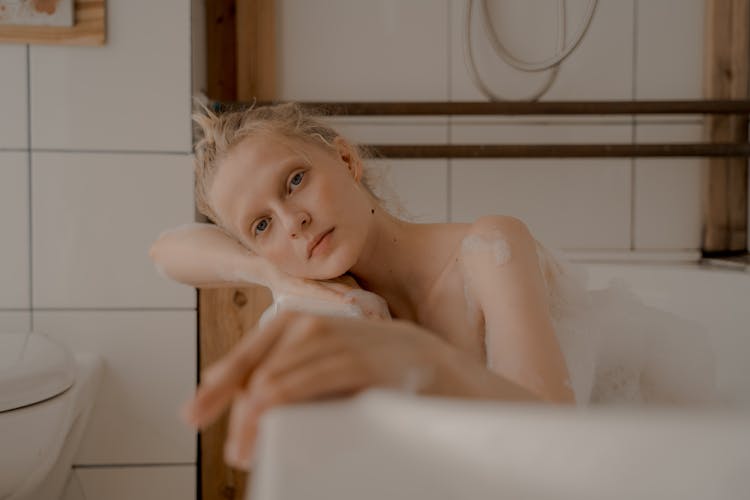 Woman Taking Bath In Bathtub