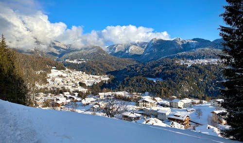 Snow Covered Village Near Mountains