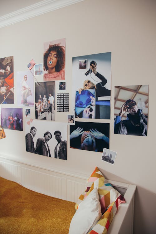 Posters Hanging on a Wall above a Bed 