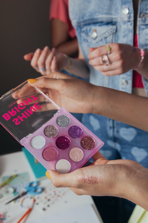 Girl Holding a Eyeshadow Palette