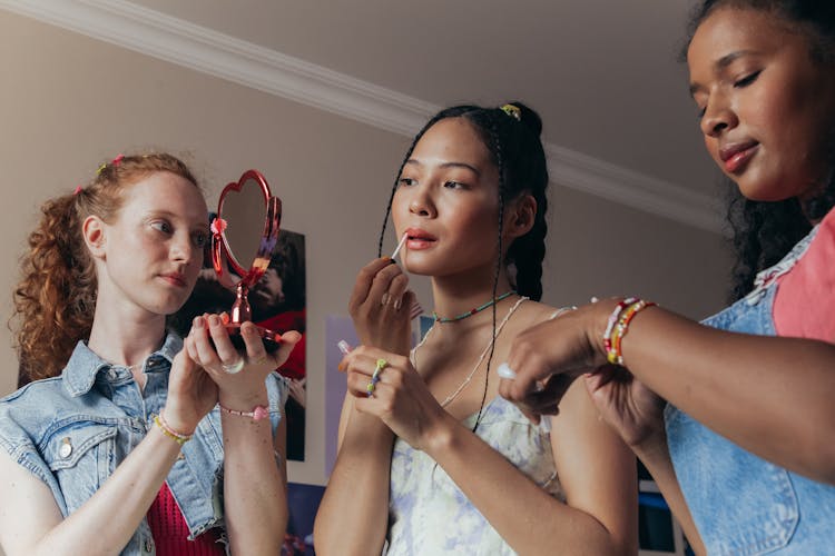 Glamorous Women Putting Makeup 