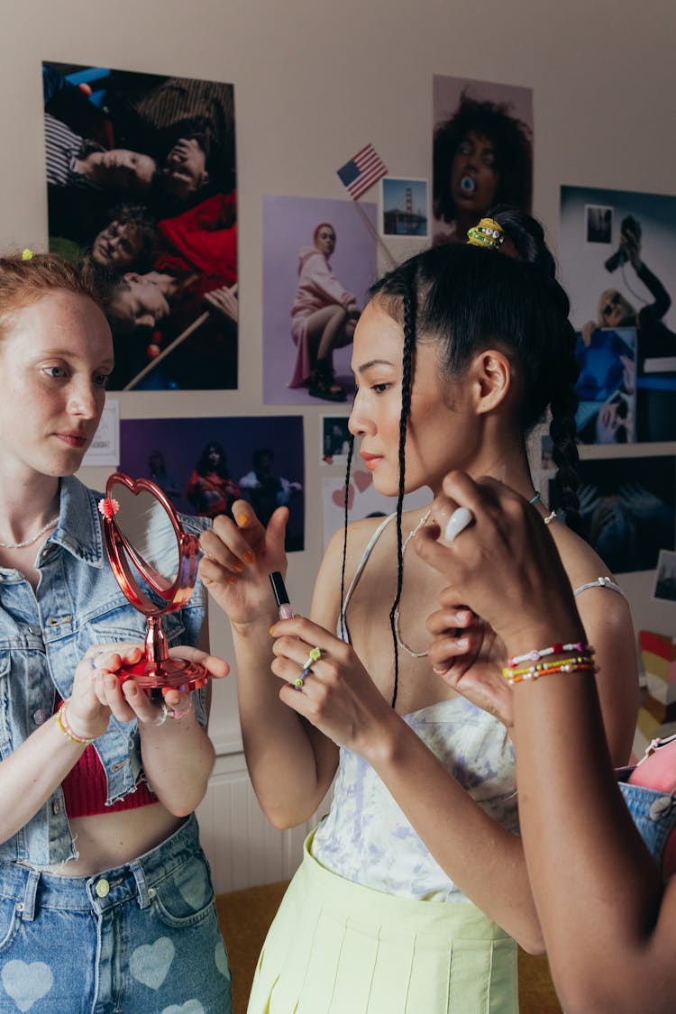 Woman Looking At Herself On The Heart Shaped Mirror 