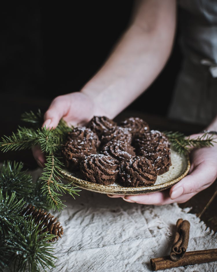 Hands Holding Plate Of Cookies