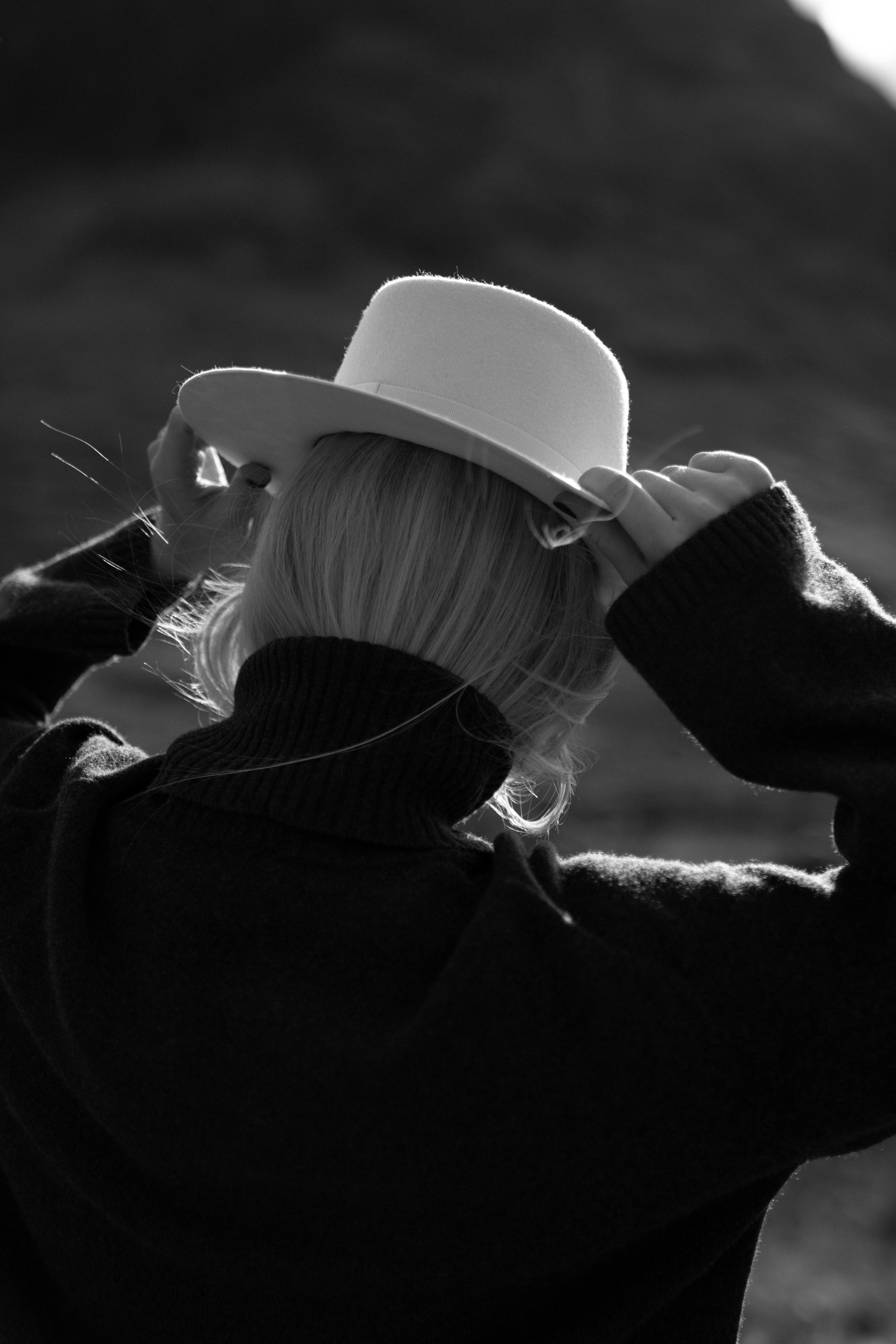 Grayscale Photo of Hats on Shelves · Free Stock Photo