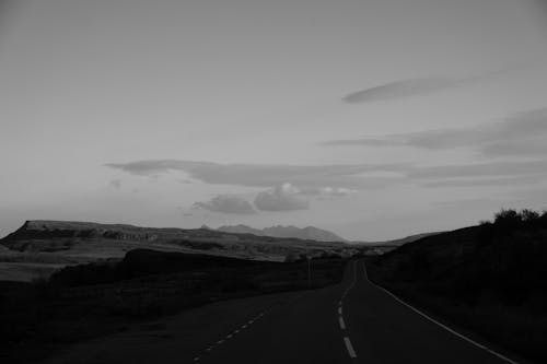 Grayscale Photo of an Empty Road