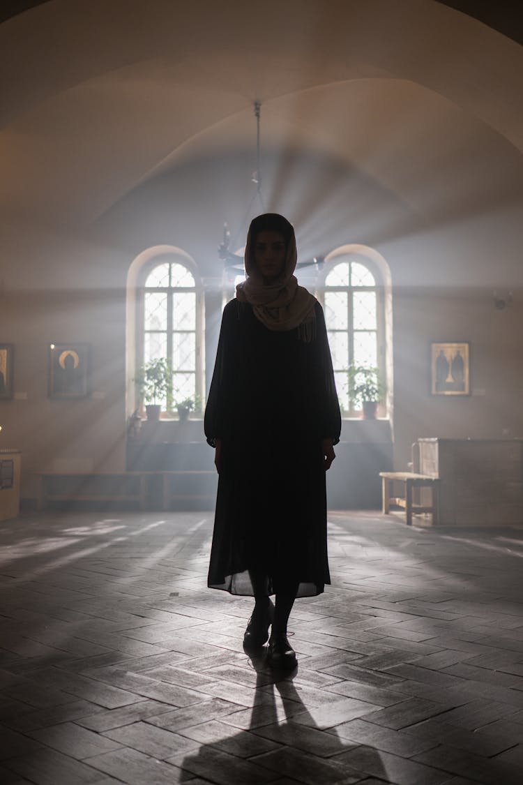 Light From Windows On Woman Walking In Orthodox Church