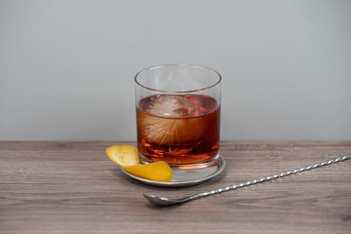 Free Clear Drinking Glass on a Coaster Stock Photo