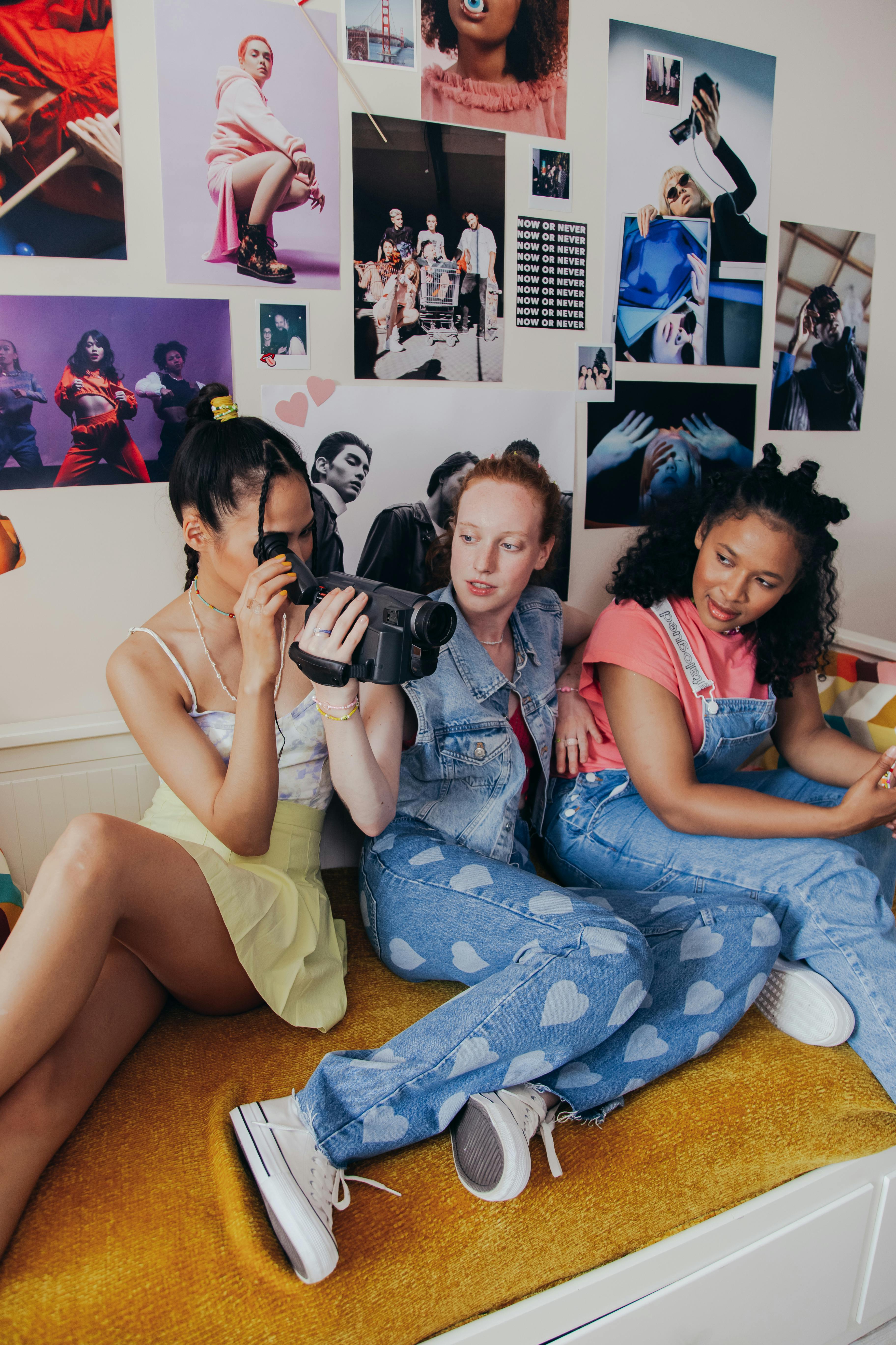 girls sitting on a bed