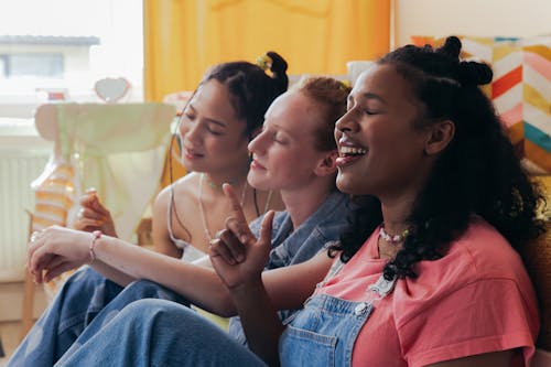 Stylish Women Sitting with their Eyes Closed 