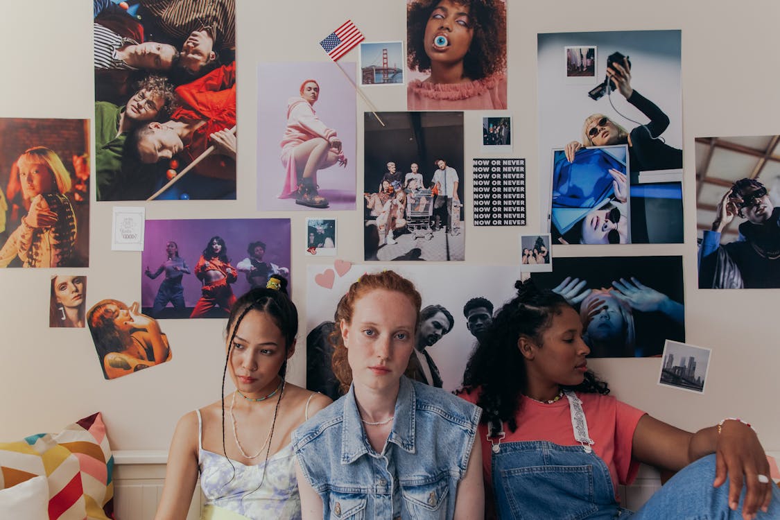 Friends Sitting Near a Wall