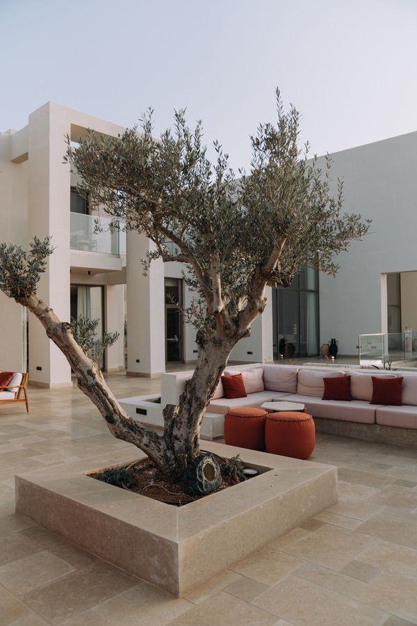 Finished stone patio beside a modern home