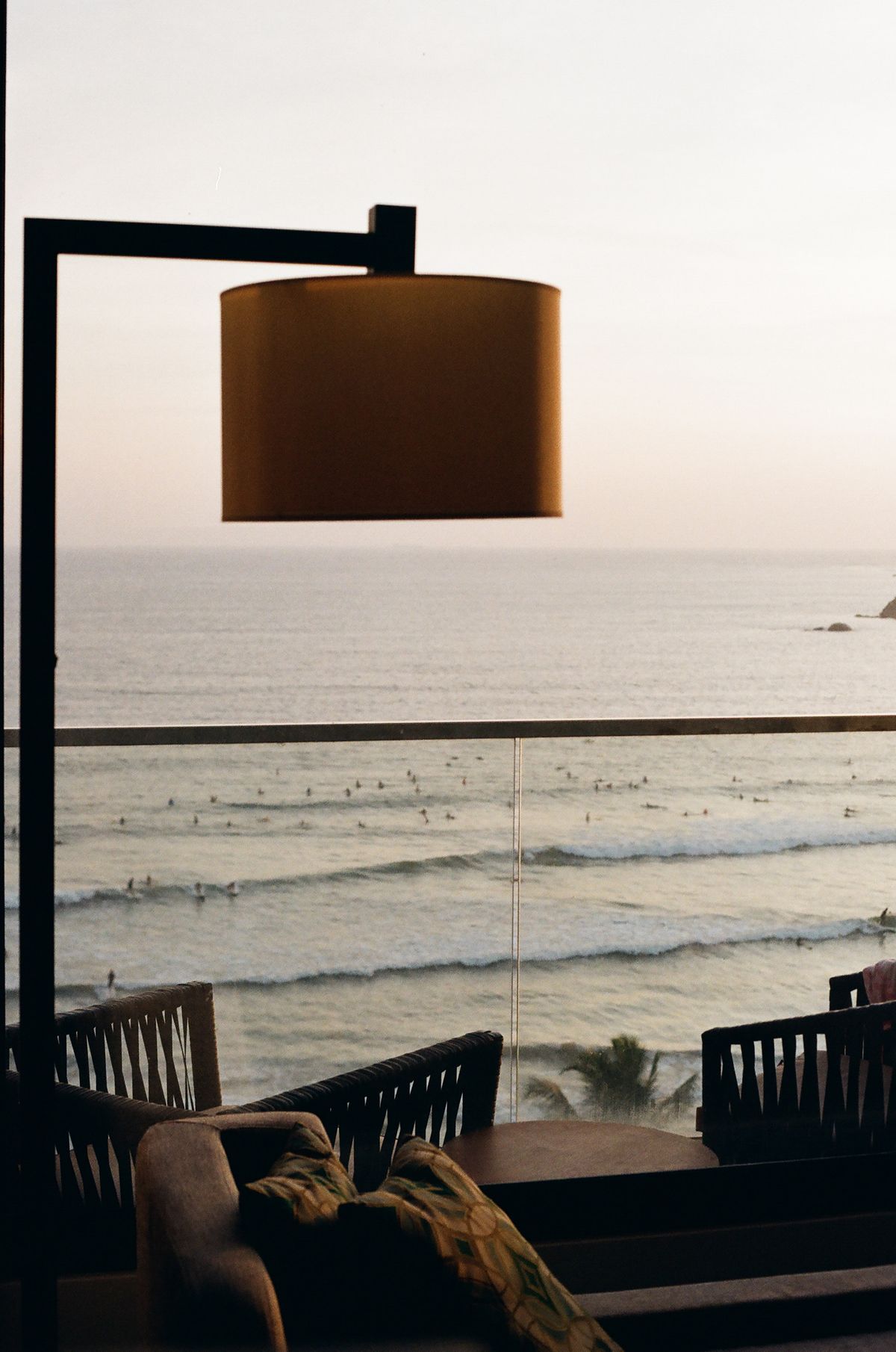 Coastal reading corner with comfortable chairs beside an ocean view