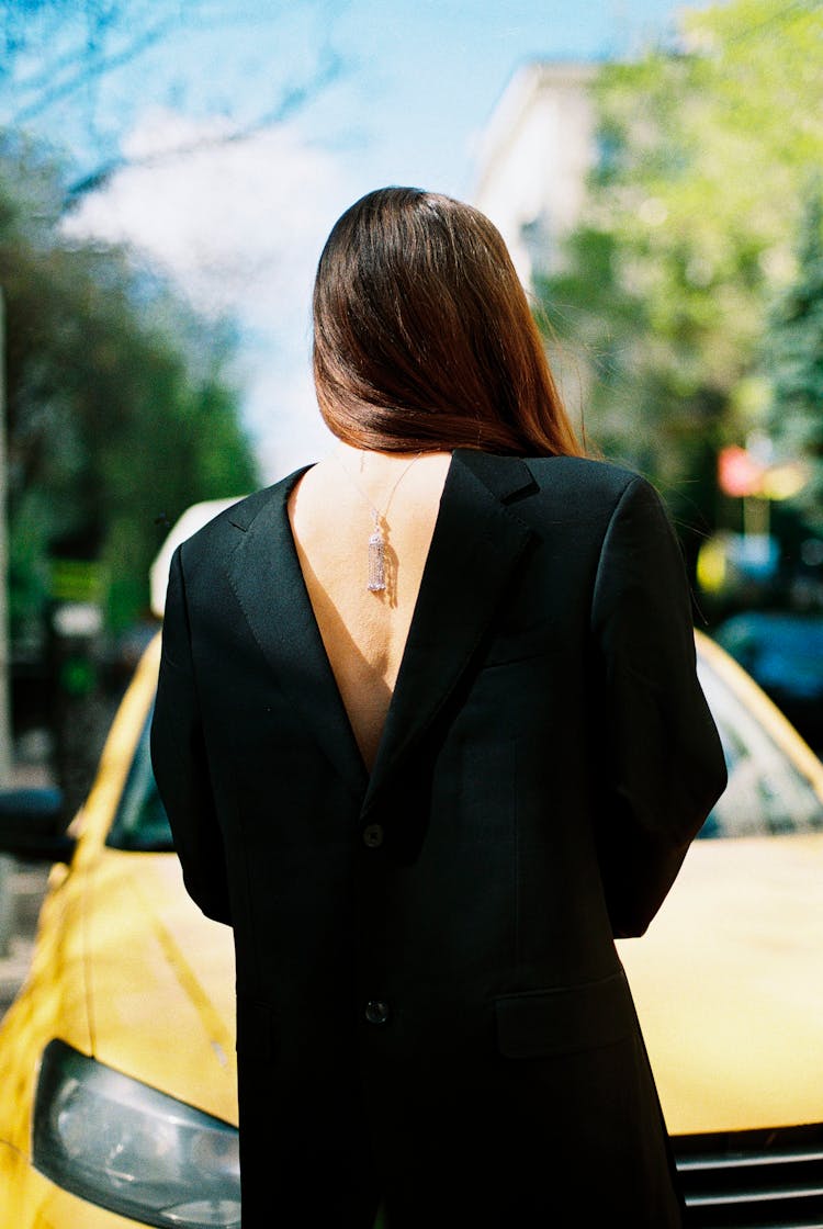 Woman Wearing Suit Jacket Backwards