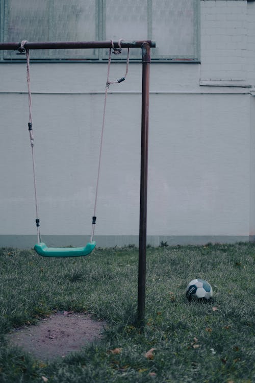 Free 
An Outdoor Swing and a Soccer Ball Stock Photo