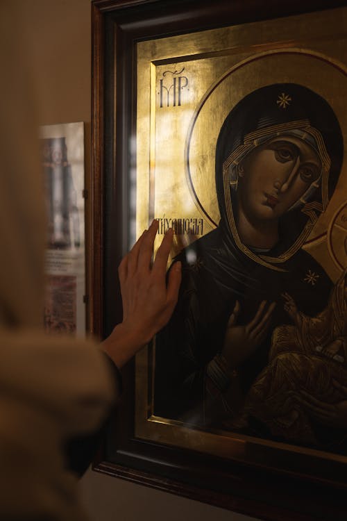 Hand on a Painting of Mary