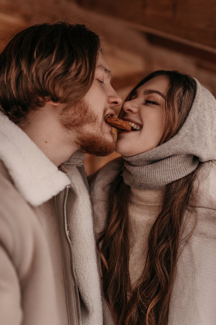 Couple Eating Cookie Together