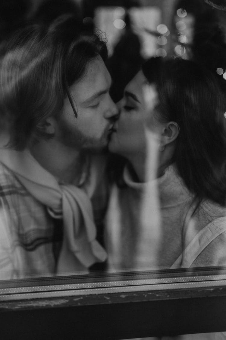 Black And White Portrait Of Kissing Man And Woman