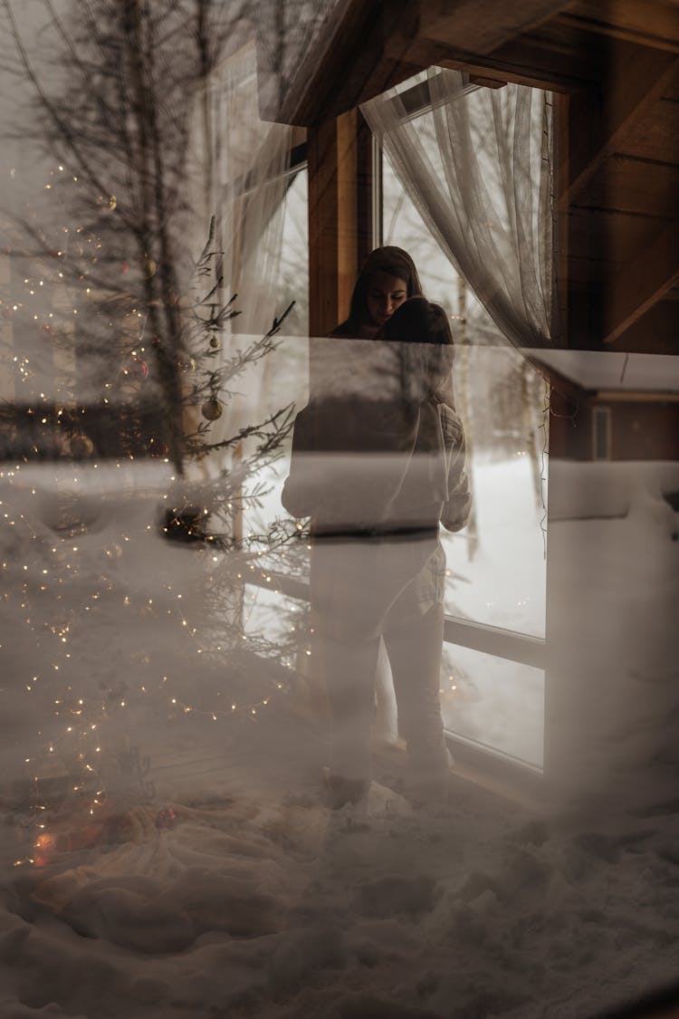 Woman Reflected In Window On Winter Day