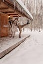 Man Slipping on Snow and Holding Hand of Woman
