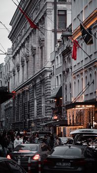 Lively Istanbul street scene capturing historic architecture, traffic, and festive lights at dusk.