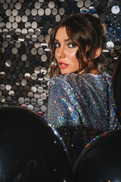 Woman in Sparkly Dress Looking Over Shoulder