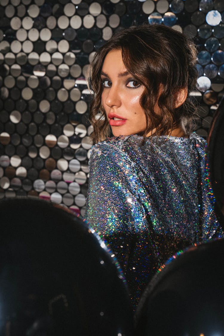 Woman In Sparkly Dress Looking Over Shoulder