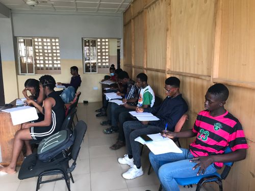 Free A group of students attentively participating in an educational class session indoors. Stock Photo