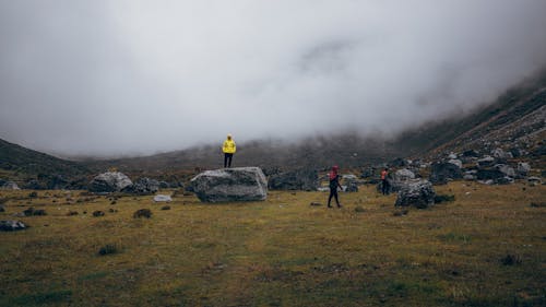 Men in a Valley Covered in Mist