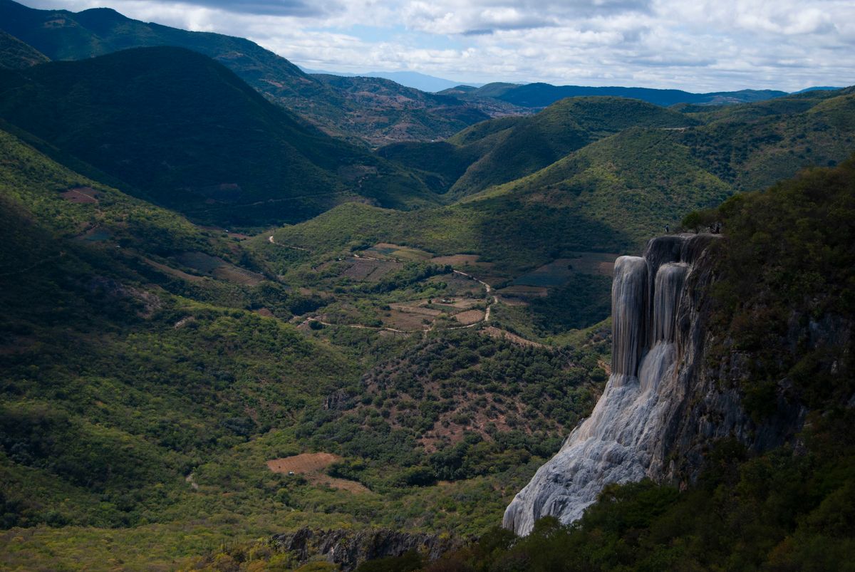 Breathtaking view of Hierve el Agua waterfall and mountains in Oaxaca, Mexico.