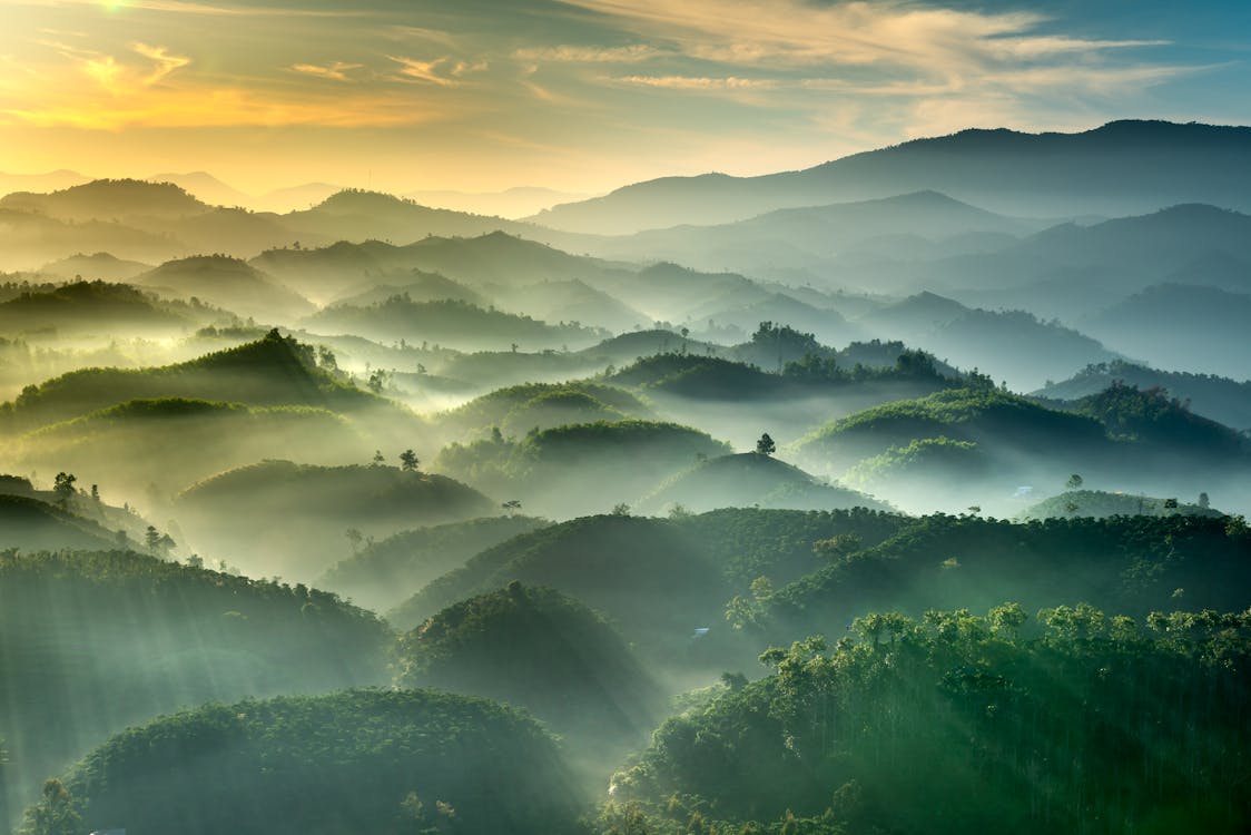 Fog and Sunlight Over Hills and Mountains