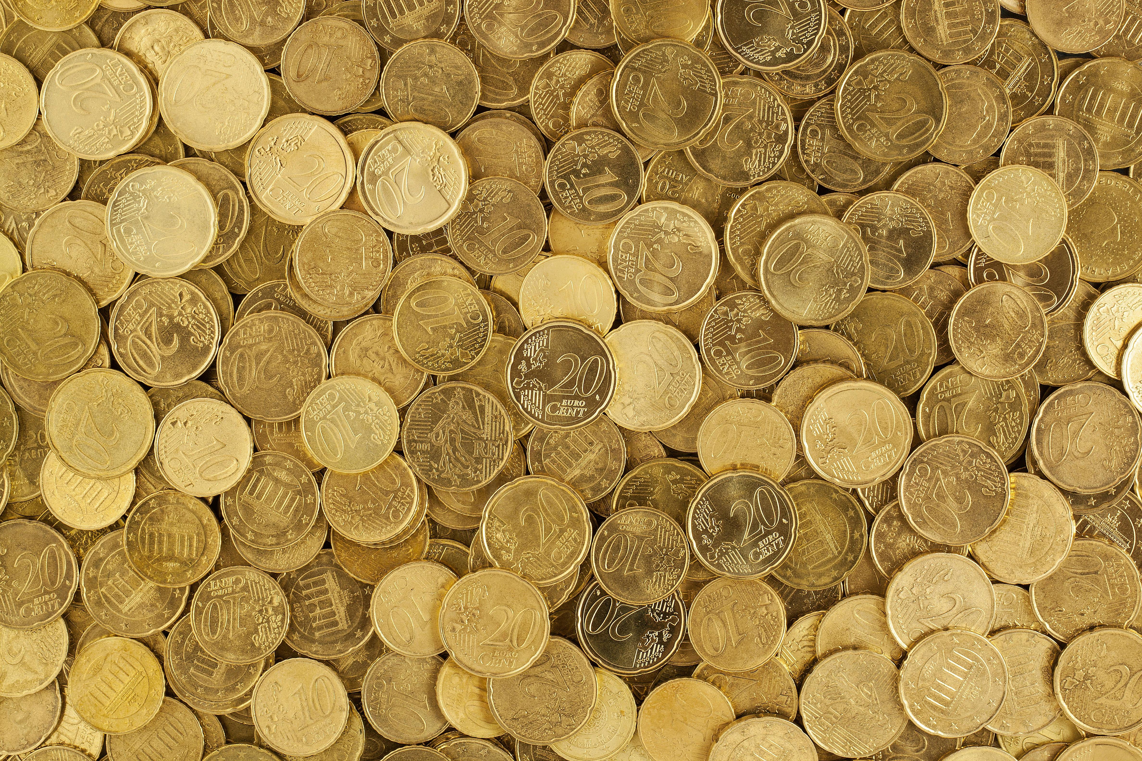 Gold Coins in Person's Hands · Free Stock Photo