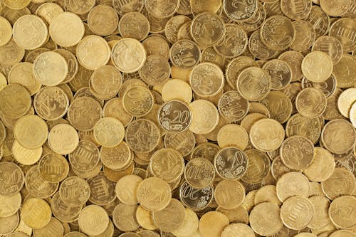 Free Pile of Gold Round Coins Stock Photo