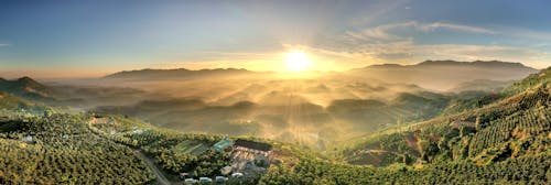 Fog and Sunlight Over Hills and Mountains