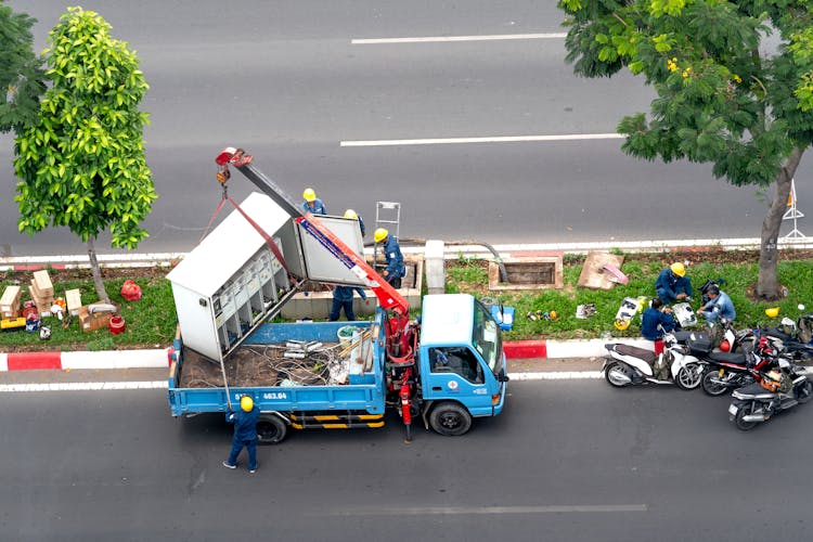 Workers And Truck On City Street