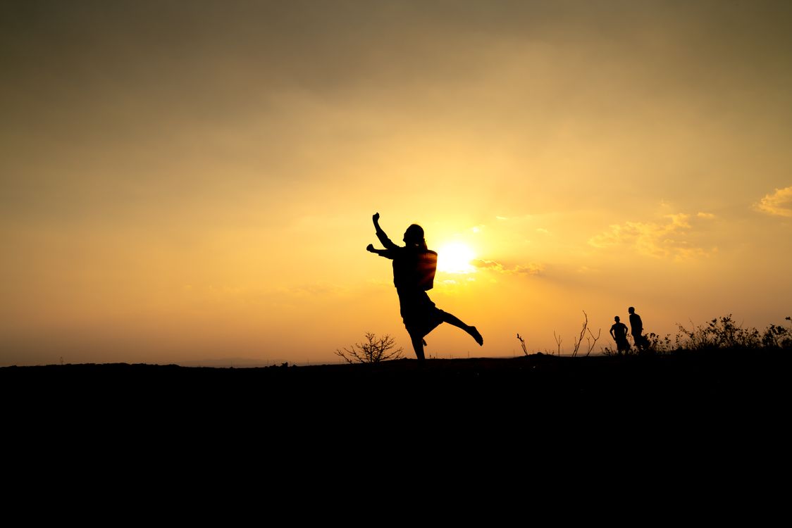 Silhouette of Woman Posing during Sunset · Free Stock Photo