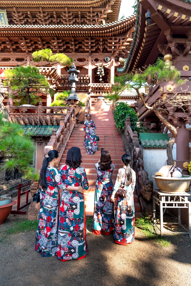 Women In Traditional Clothing By A Stairway At Minh Thanh Pagoda