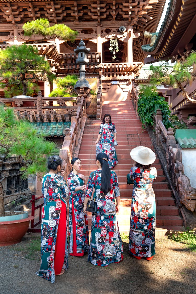 Women In Traditional Dresses Near Temple