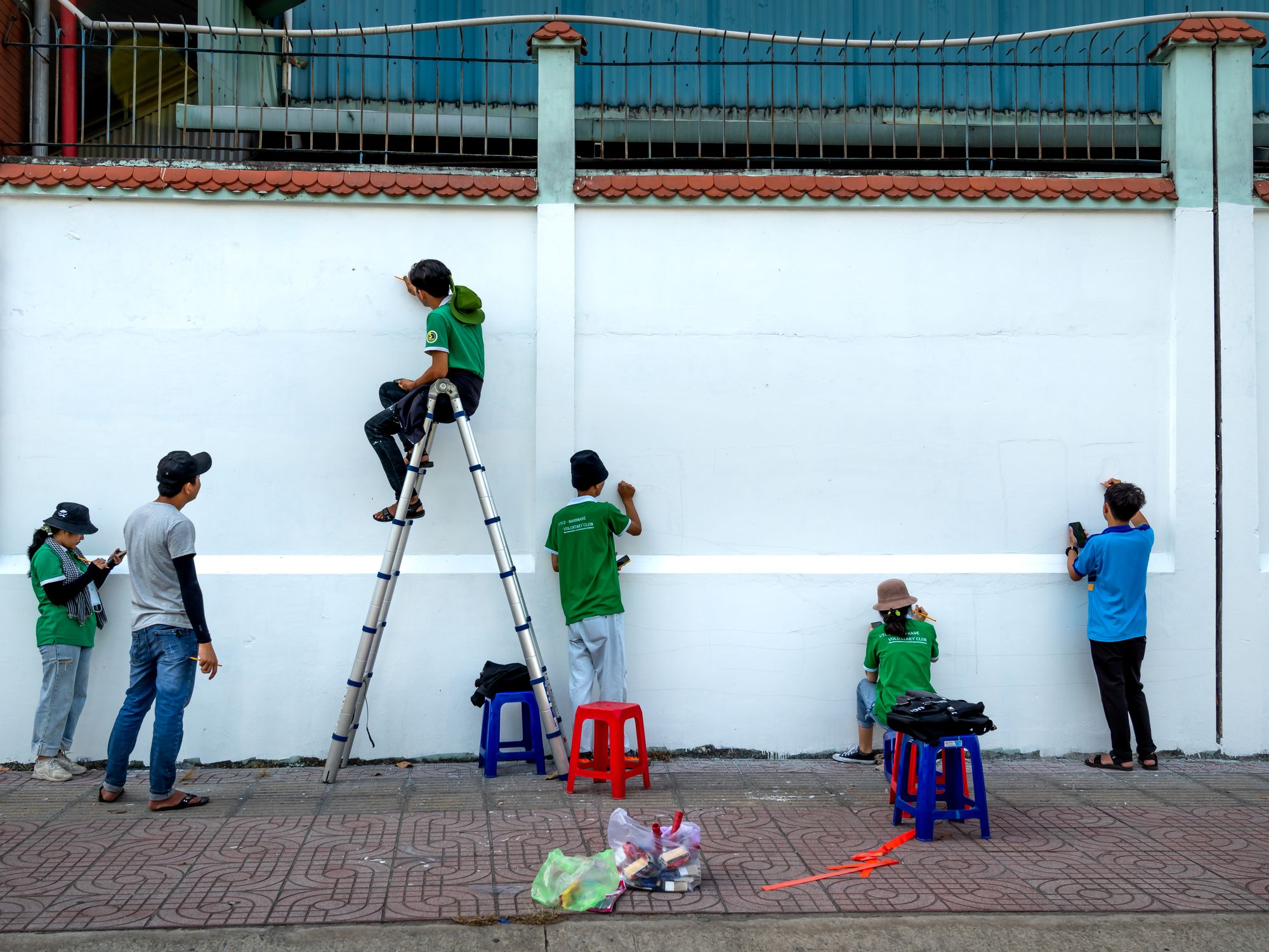 Painters & Decorators in South Hackney, London — professional decorator painting a wall with a roller