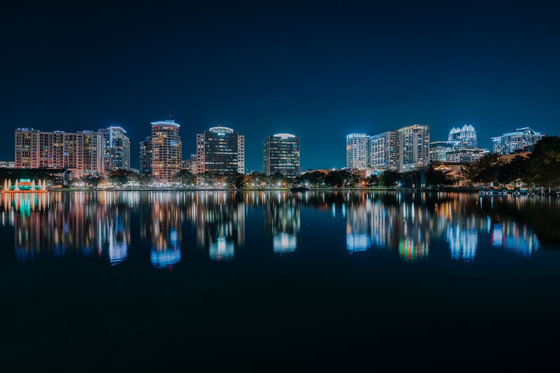 Orlando skyline at night reflecting on water