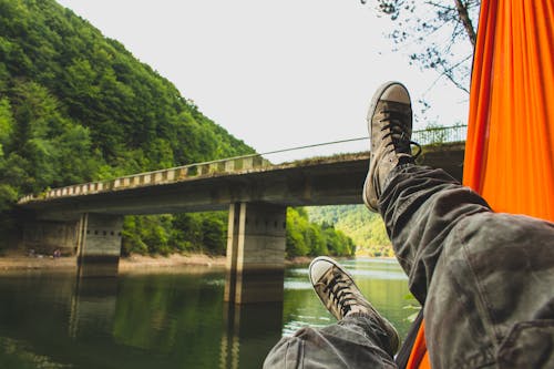 Free Person Wearing Gray Pants and Gray Low-top Sneakers Stock Photo